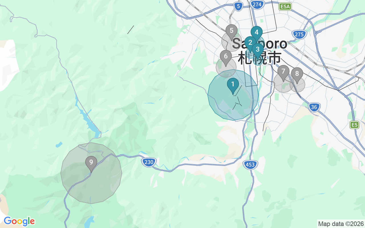 Map of Airbnb guest-review hotspots in Sapporo with location premium circles