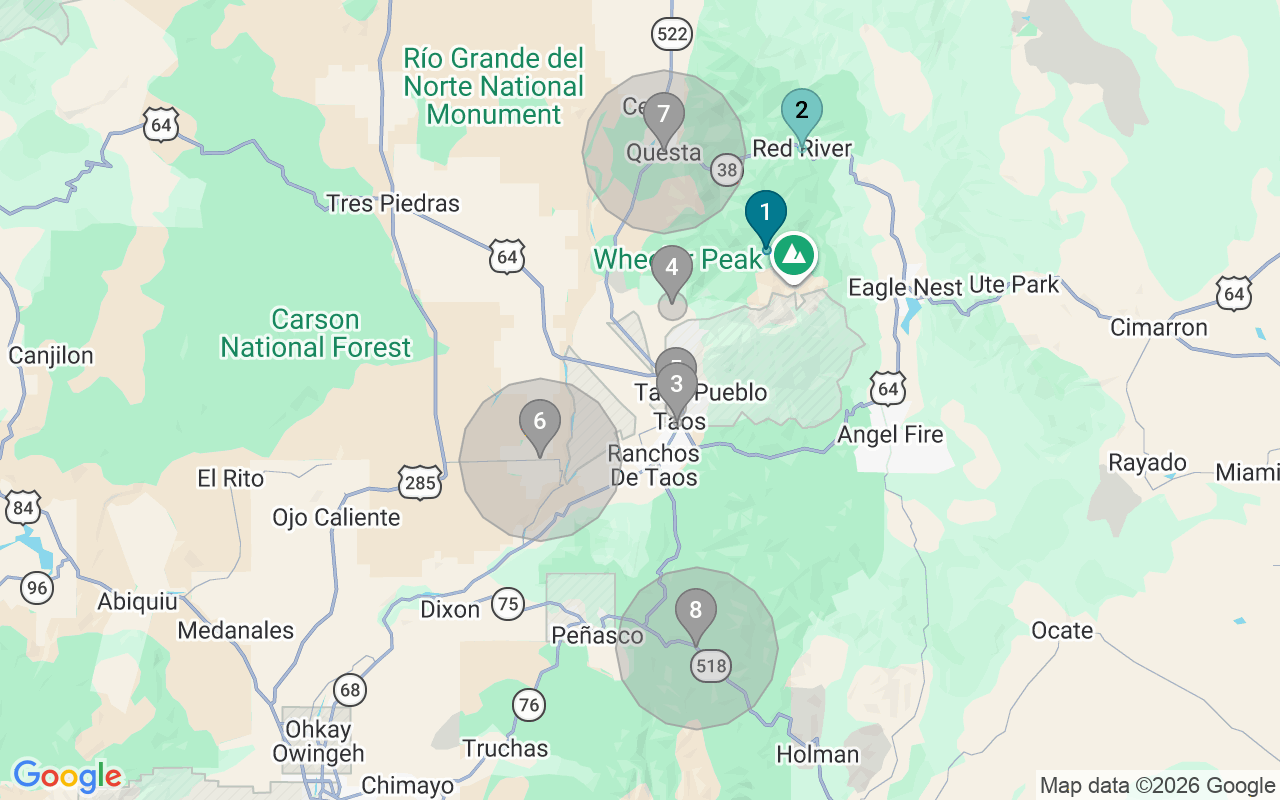 Map of Airbnb guest-review hotspots in Taos with location premium circles